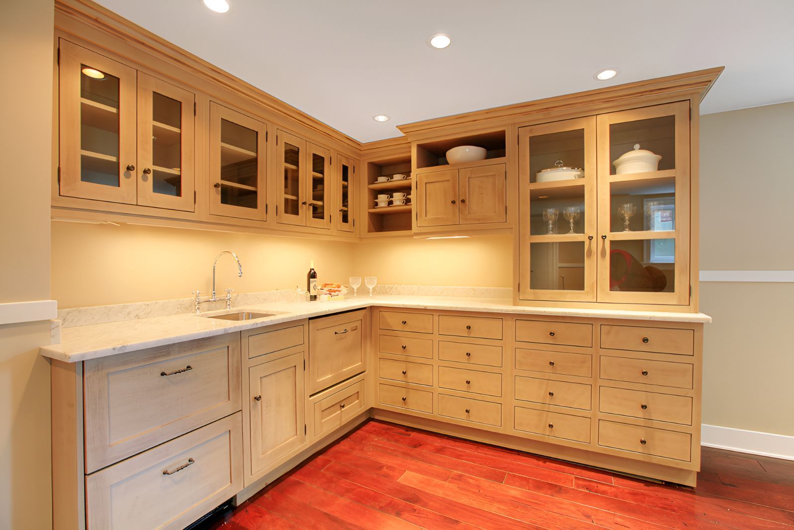 A Kitchen With Wooden Cabinets and White Counter Tops — Foreshore Kitchens In Twin Waters, QLD