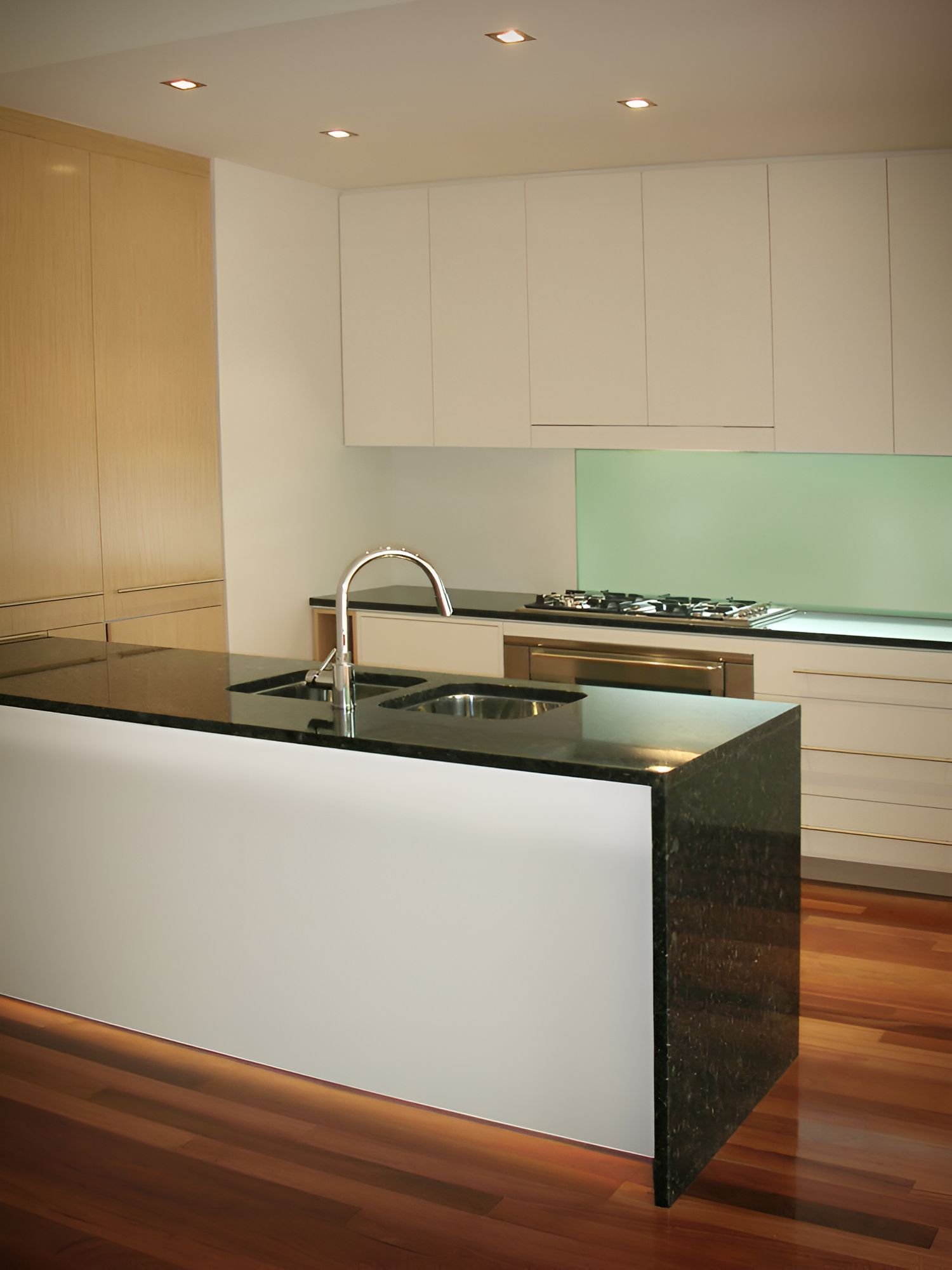 A Kitchen With Black Counter Tops and White Cabinets — Foreshore Kitchens In Caloundra, QLD
