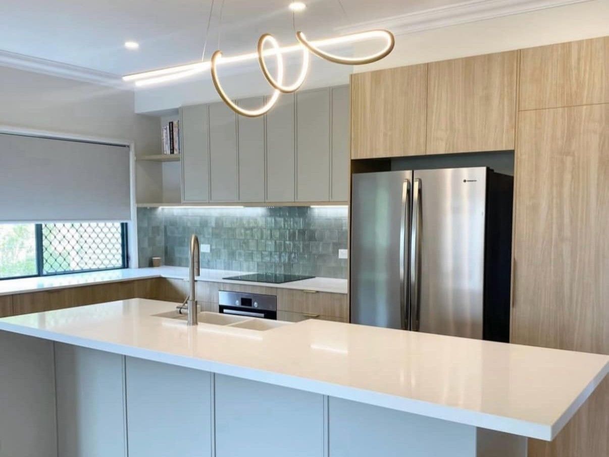 A Newly Constructed Kitchen With Wooden Cabinets