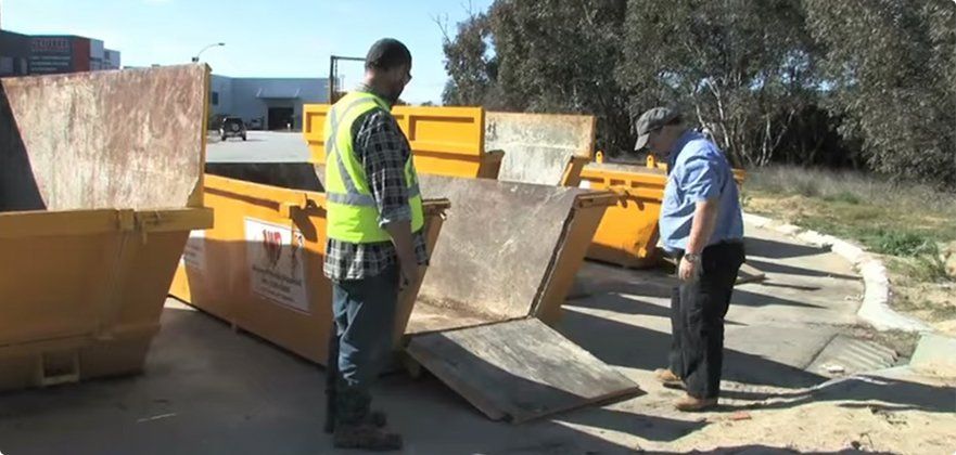 Two Man Checking The Yellow Container - Perth, WA - Advance Waste Disposal