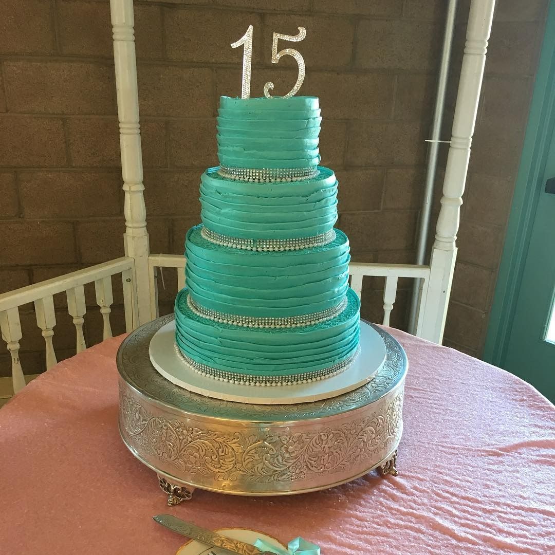 Pink birthday cake with red number candles 1 and 5 on top