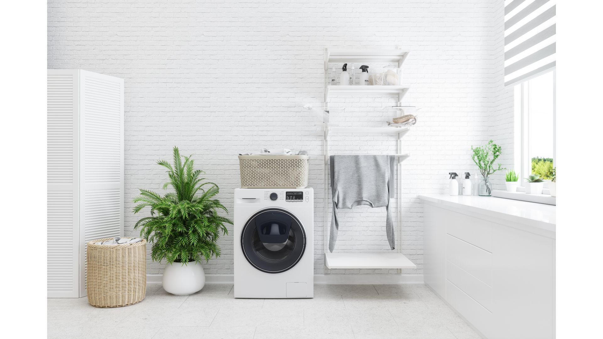 a laundry room with a washing machine and baskets