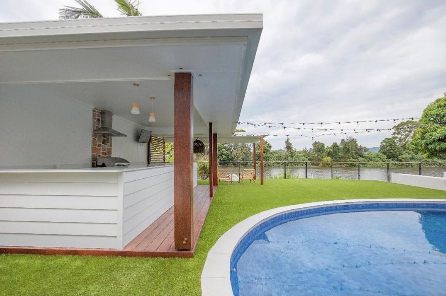 a house with a swimming pool in the backyard