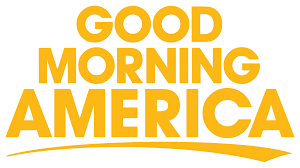 The yellow logo for the television program Good Morning America, featuring the show's name above a curved yellow line.