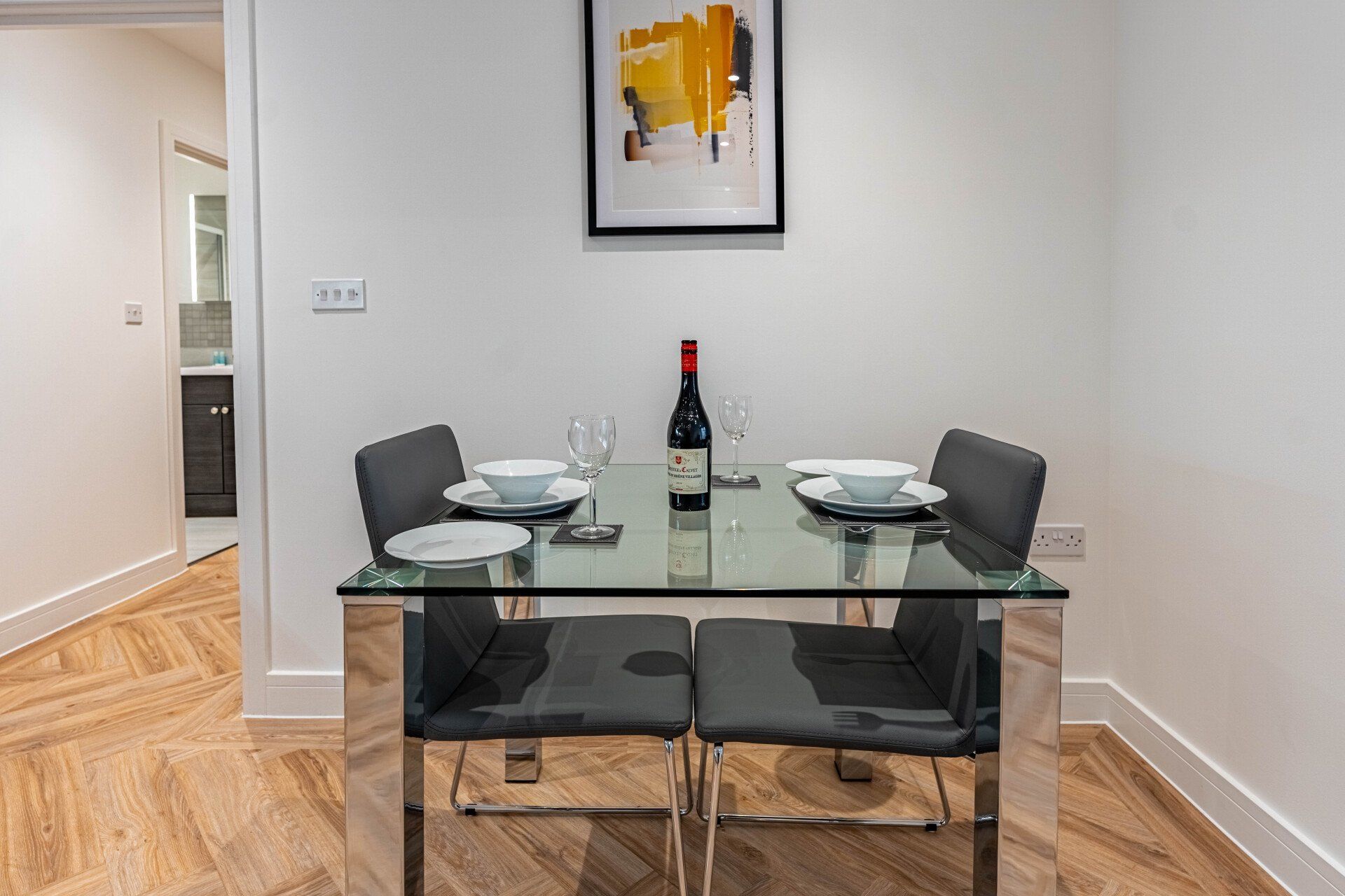 Celador Apartments Bond house, Reading, dining room table and chairs with wine on table for dinner