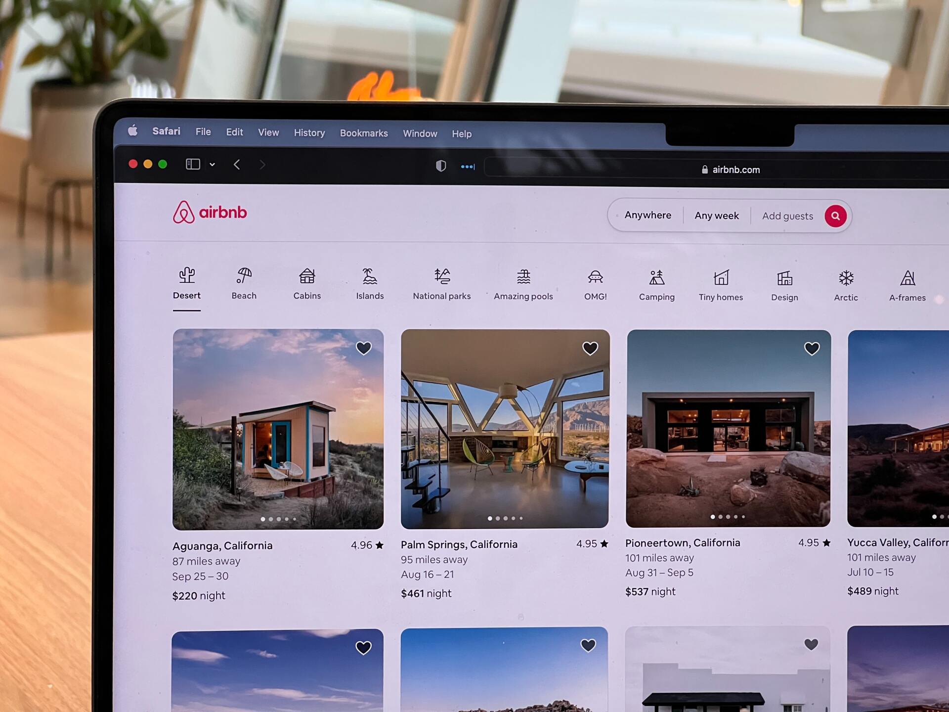 laptop browsing Airbnb listings