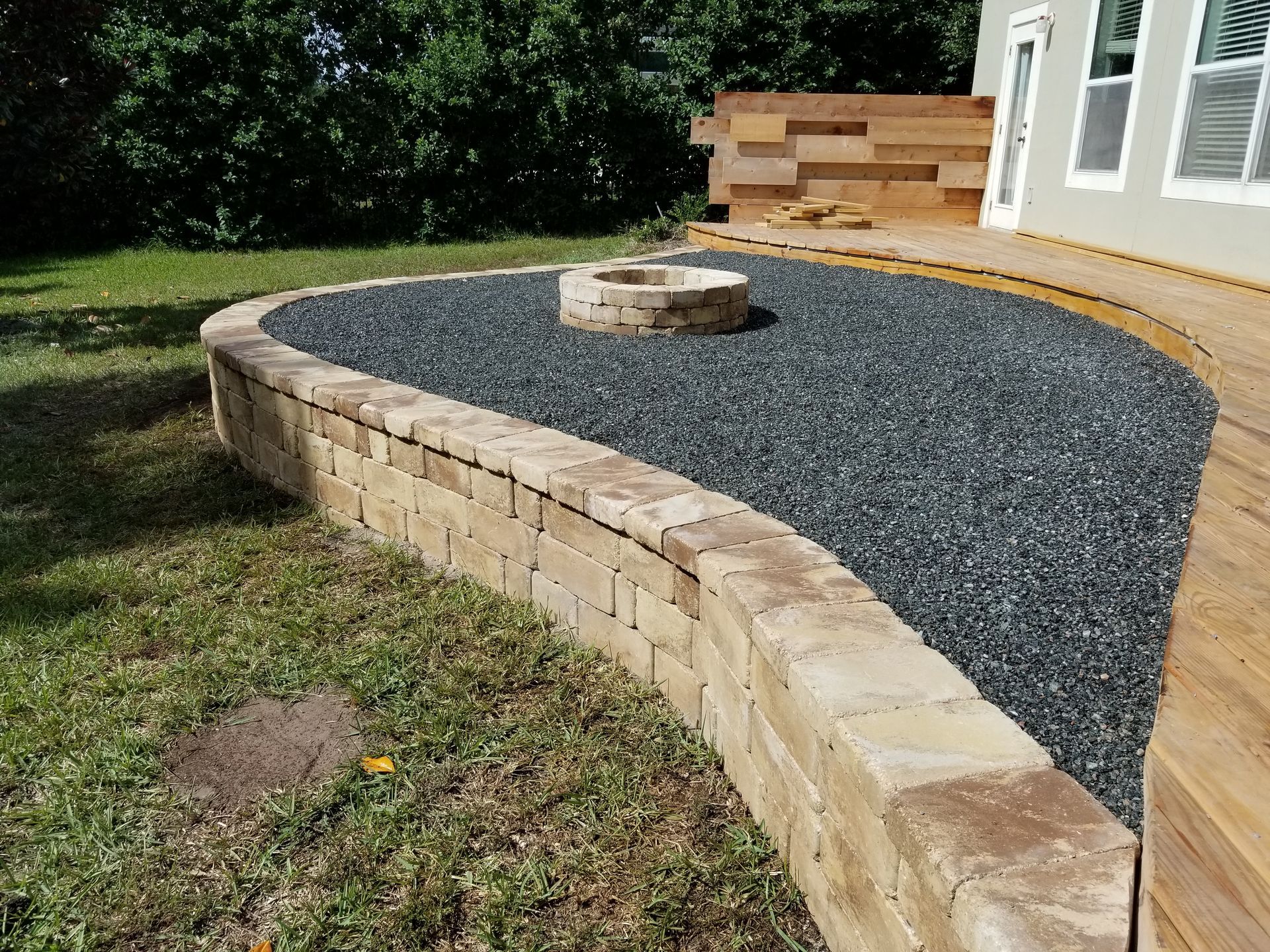 There is a fire pit in the middle of the yard.