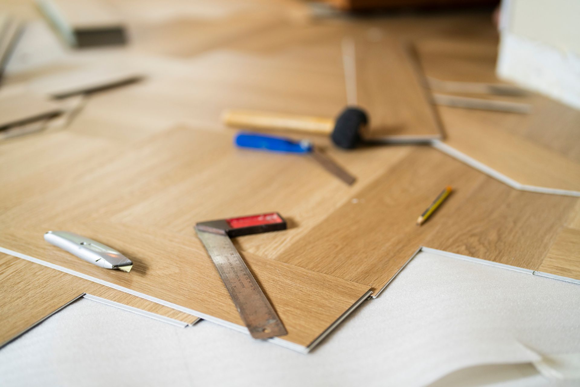 Laminate flooring with tools.