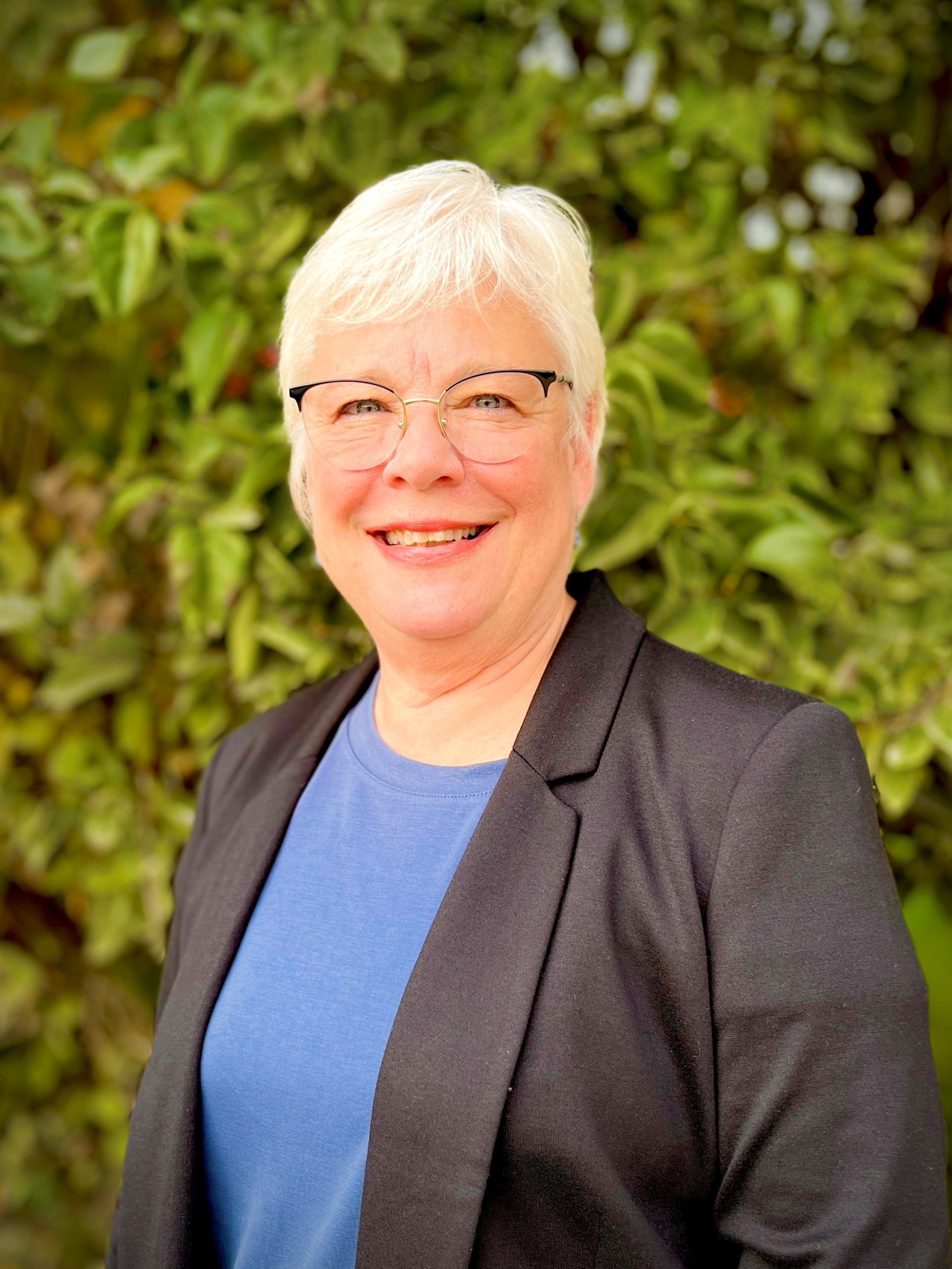 A person looking professional wearing a black coat.