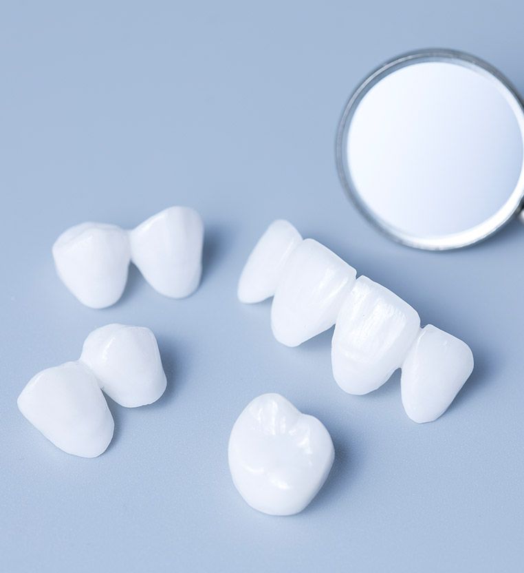 White teeth and a mirror on a blue surface