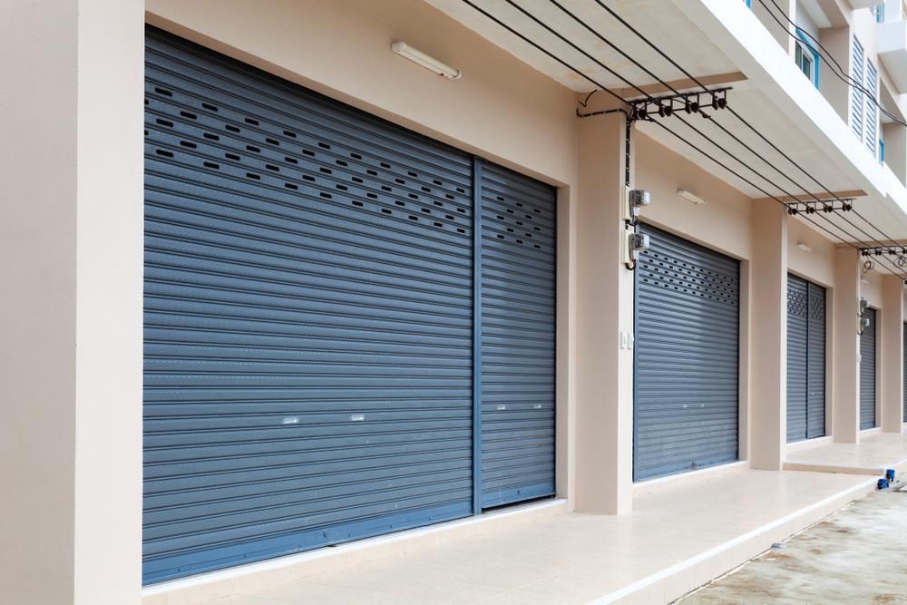 a Row of Closed Roller Shutters on the Side of a Building — Armstrong Locksmiths Ballarat in Ballarat East, VIC