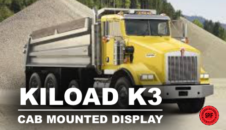 A yellow dump truck is parked in front of a pile of gravel.