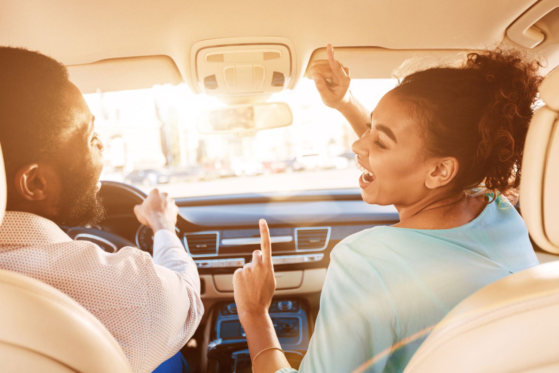Couple Dancing in Front of a care — Oakwood, GA — Ace Lock & Safe Security