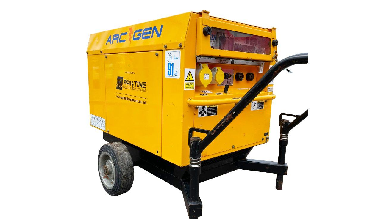 A yellow generator is sitting on a trailer on a white background.