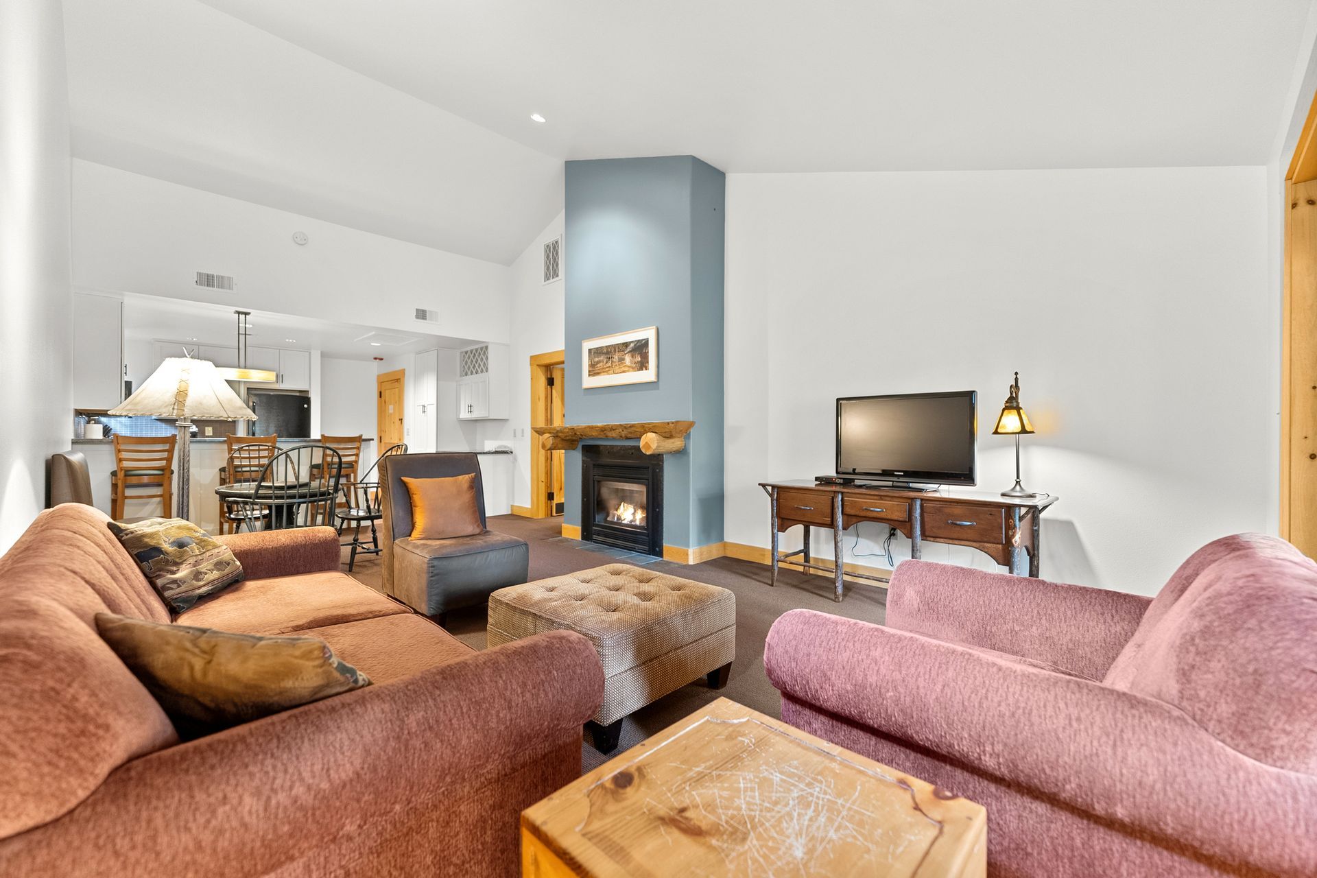 A living room with a fireplace and a couch
