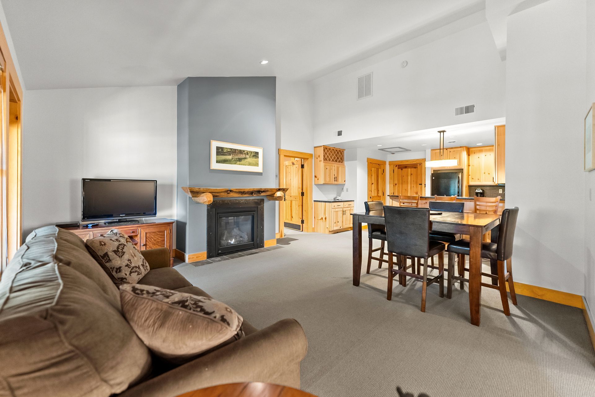A living room with a fireplace and a couch
