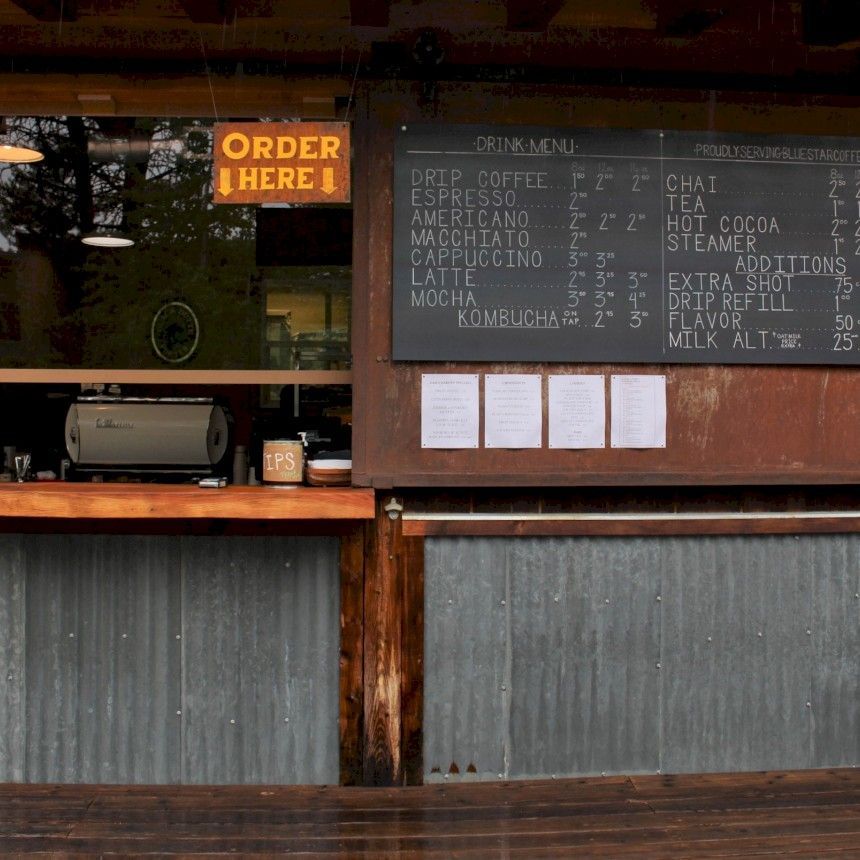 A restaurant with a sign that says order here