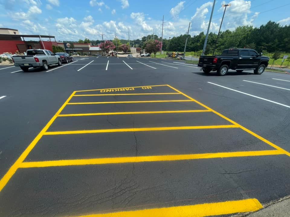 A parking lot with a yellow-painted 