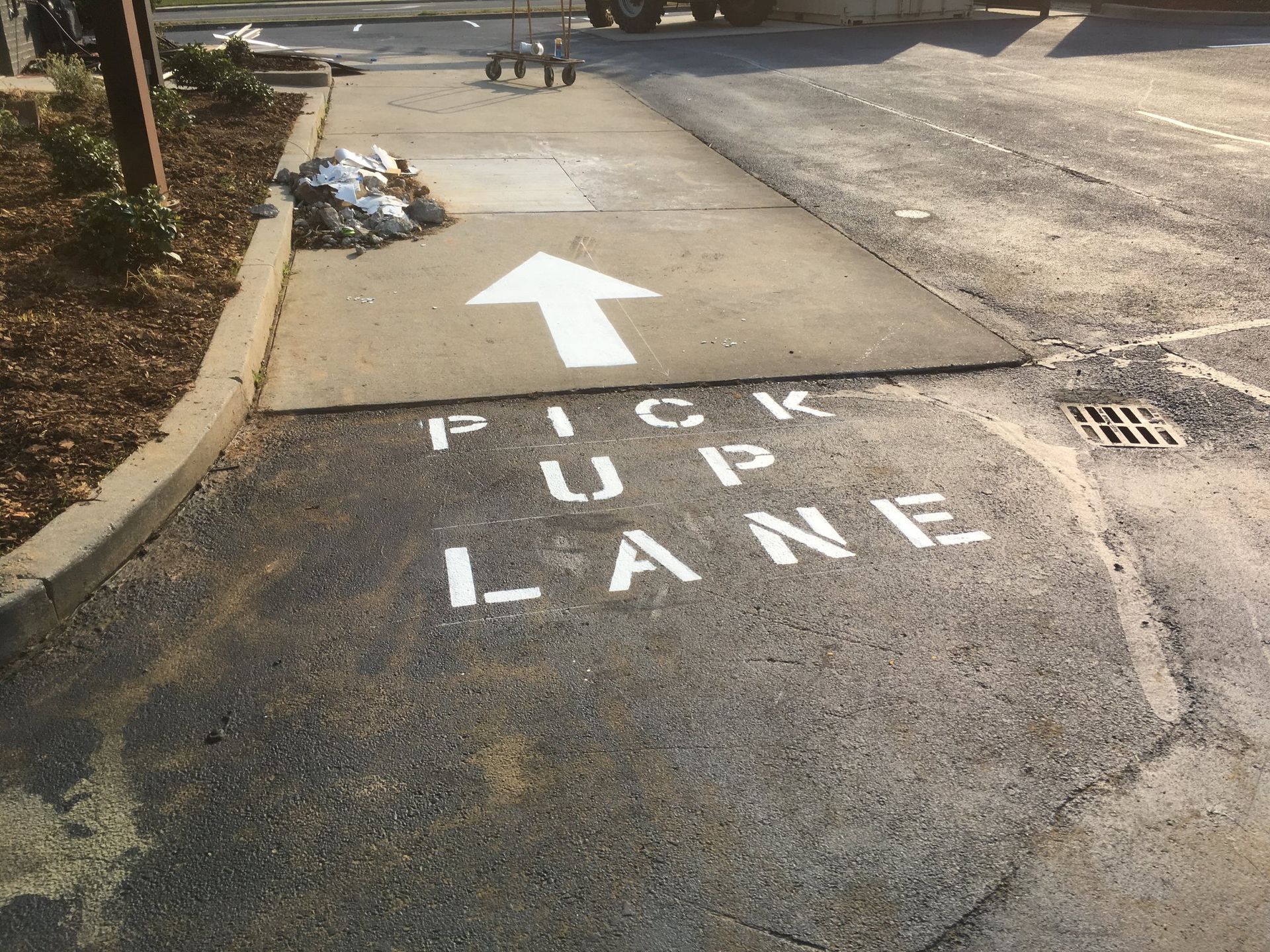 A white painted arrow and the text 