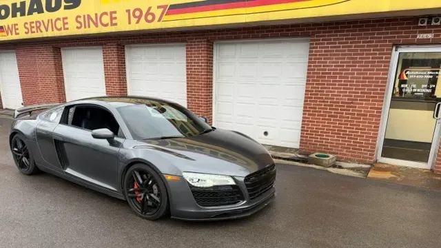 Black car parked in front of auto repair shop | Autohaus Merkle