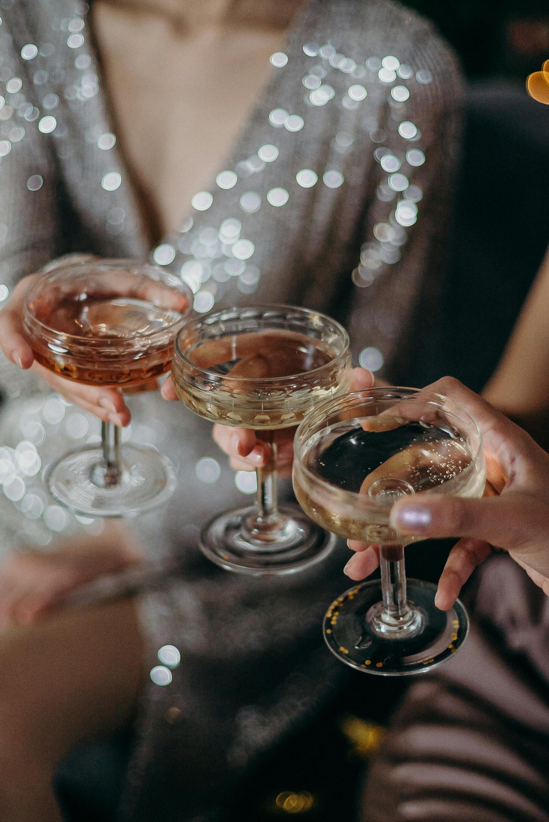 A group of people are toasting with champagne glasses.