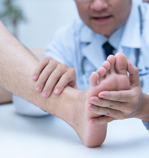 Doctor Examining Patient's Foot | Sheffield, AL | Martin Foot Specialists, Inc
