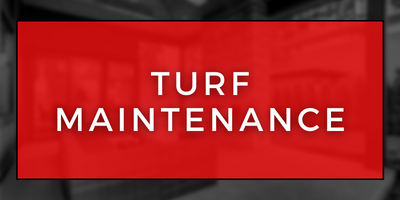 Red sign with white text reading “Turf Maintenance”