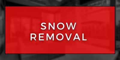 Red sign reading “SNOW REMOVAL” on a black background