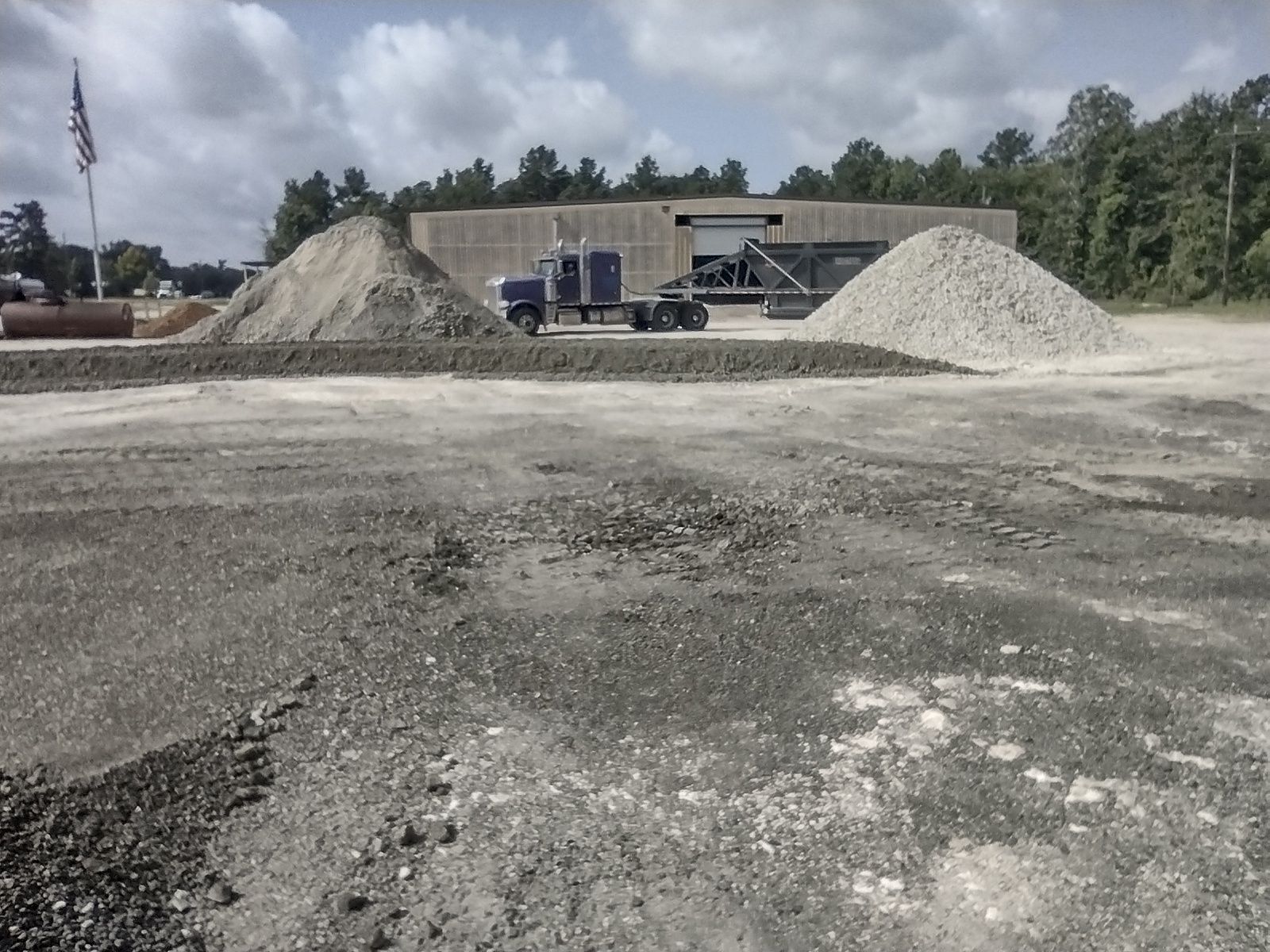 A truck is parked in front of a building that says erik