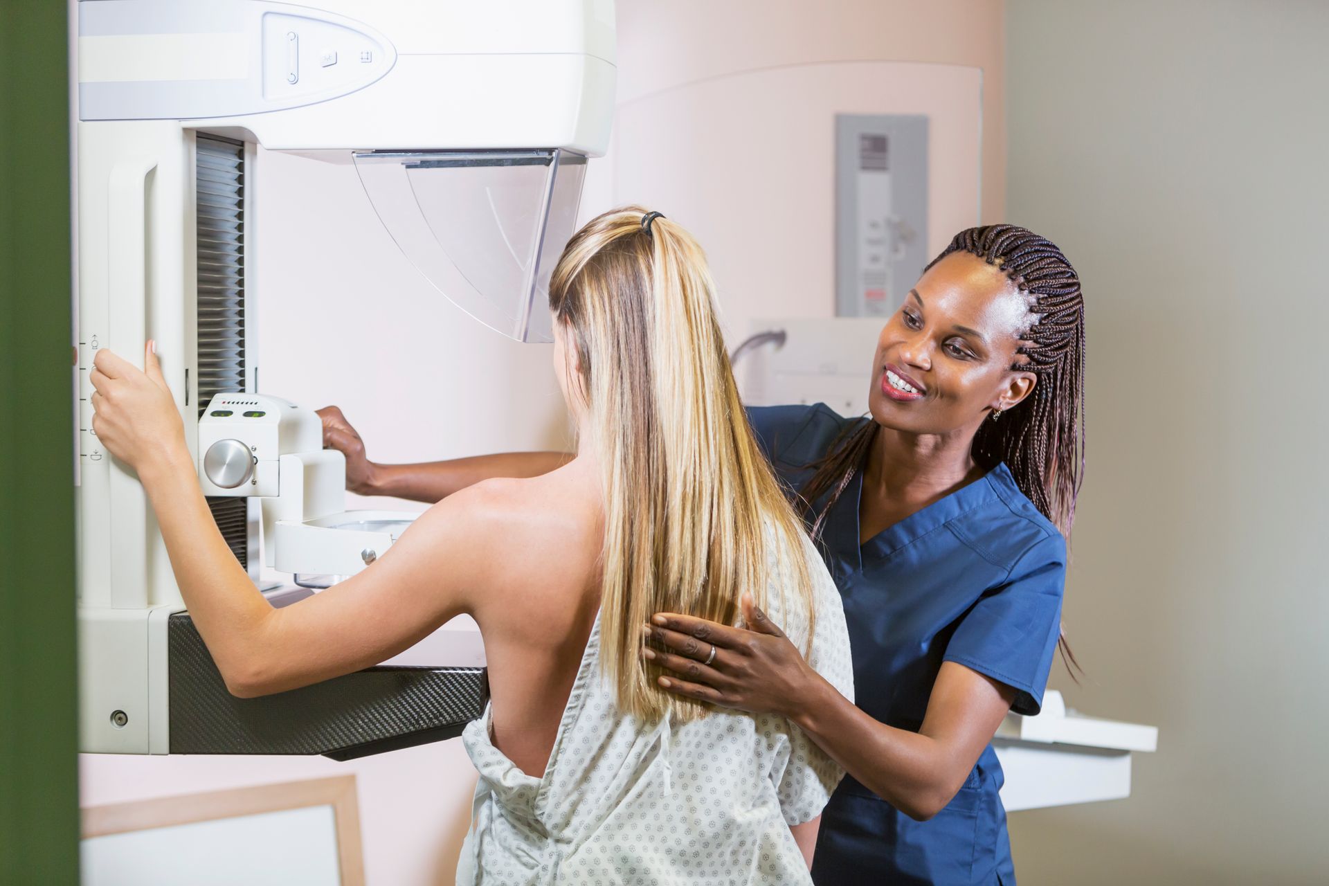 Close-up of a doctor in latex gloves standing with a hysteroscope near the patient. Close-up of a doctor in latex gloves standing with a hysteroscope near the patient.