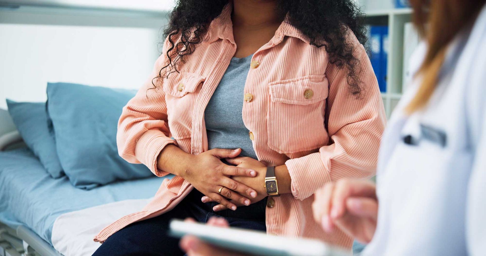 Patient exploring fertility treatment options during a medical consultation with her doctor. Patient exploring fertility treatment options during a medical consultation with her doctor.