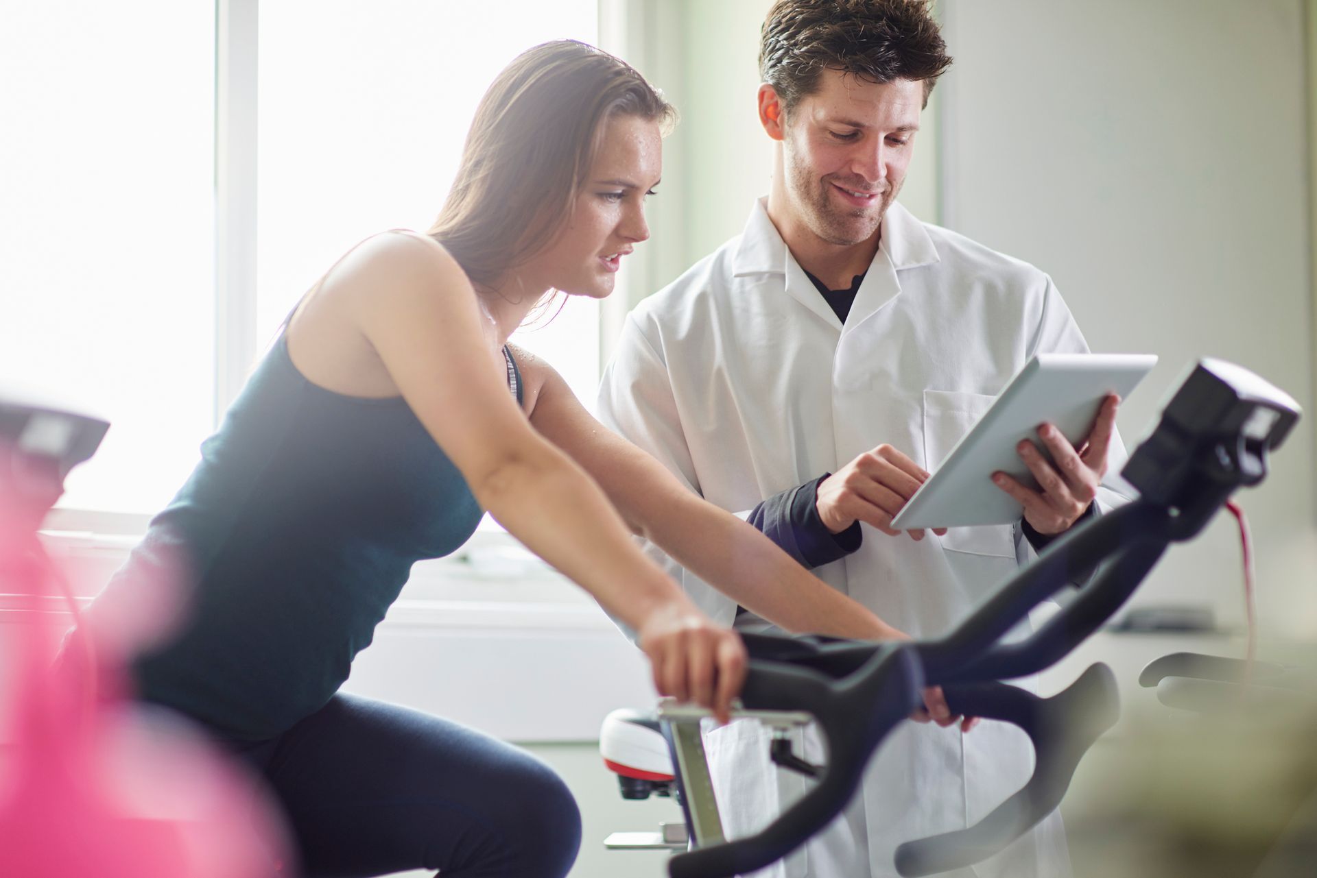 Weight management treatment at West End Obstetrics & Gynecology in Richmond, VA, with a medic assessing a woman's performance