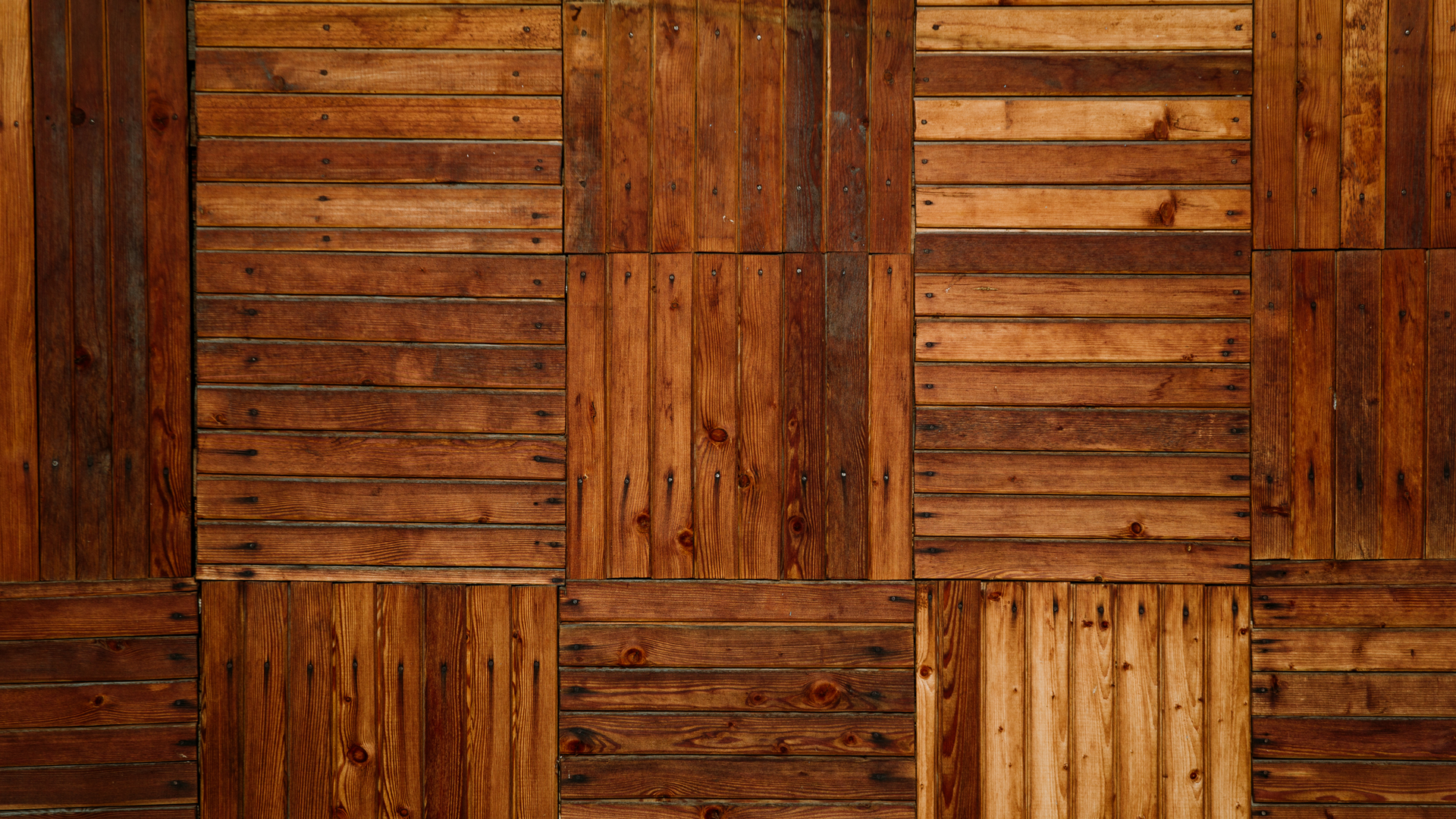 A close up of a wooden wall made of wooden boards.