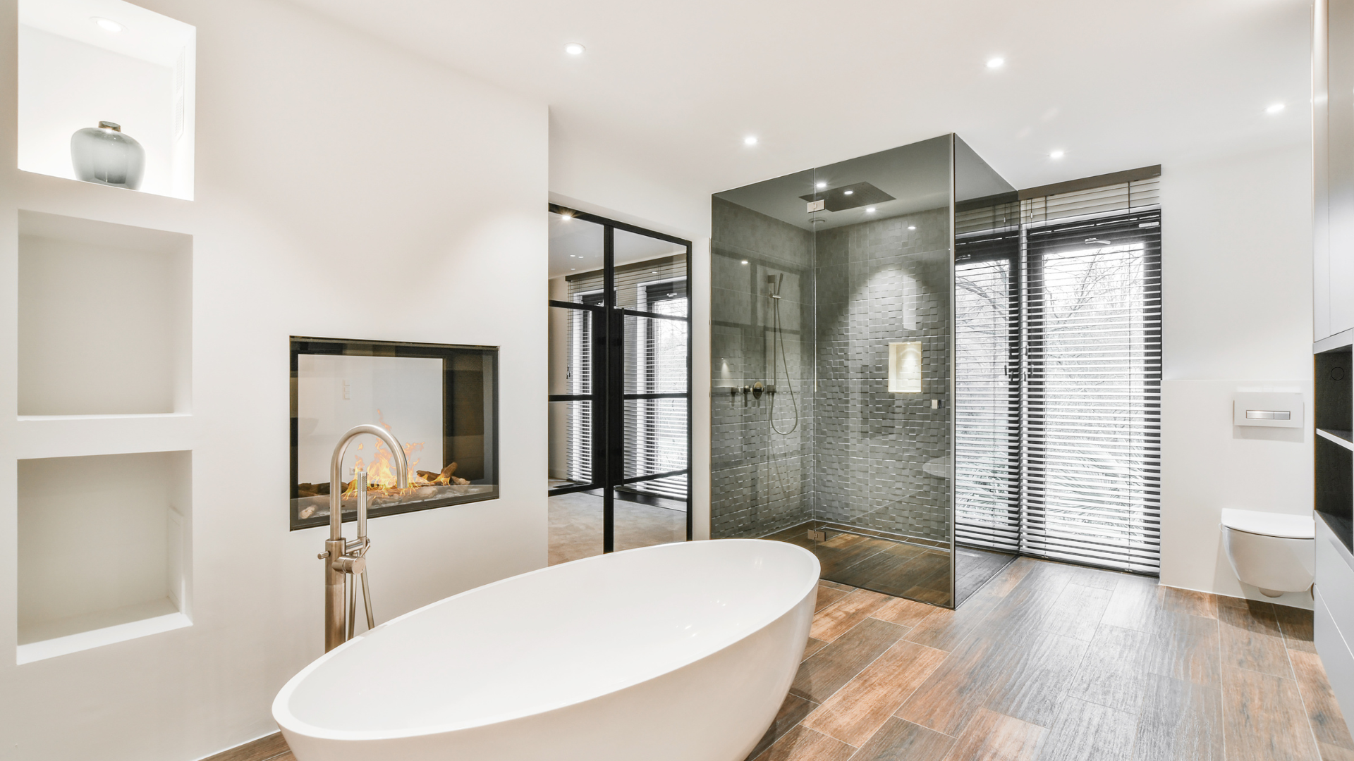 A bathroom with a bathtub and a walk in shower.