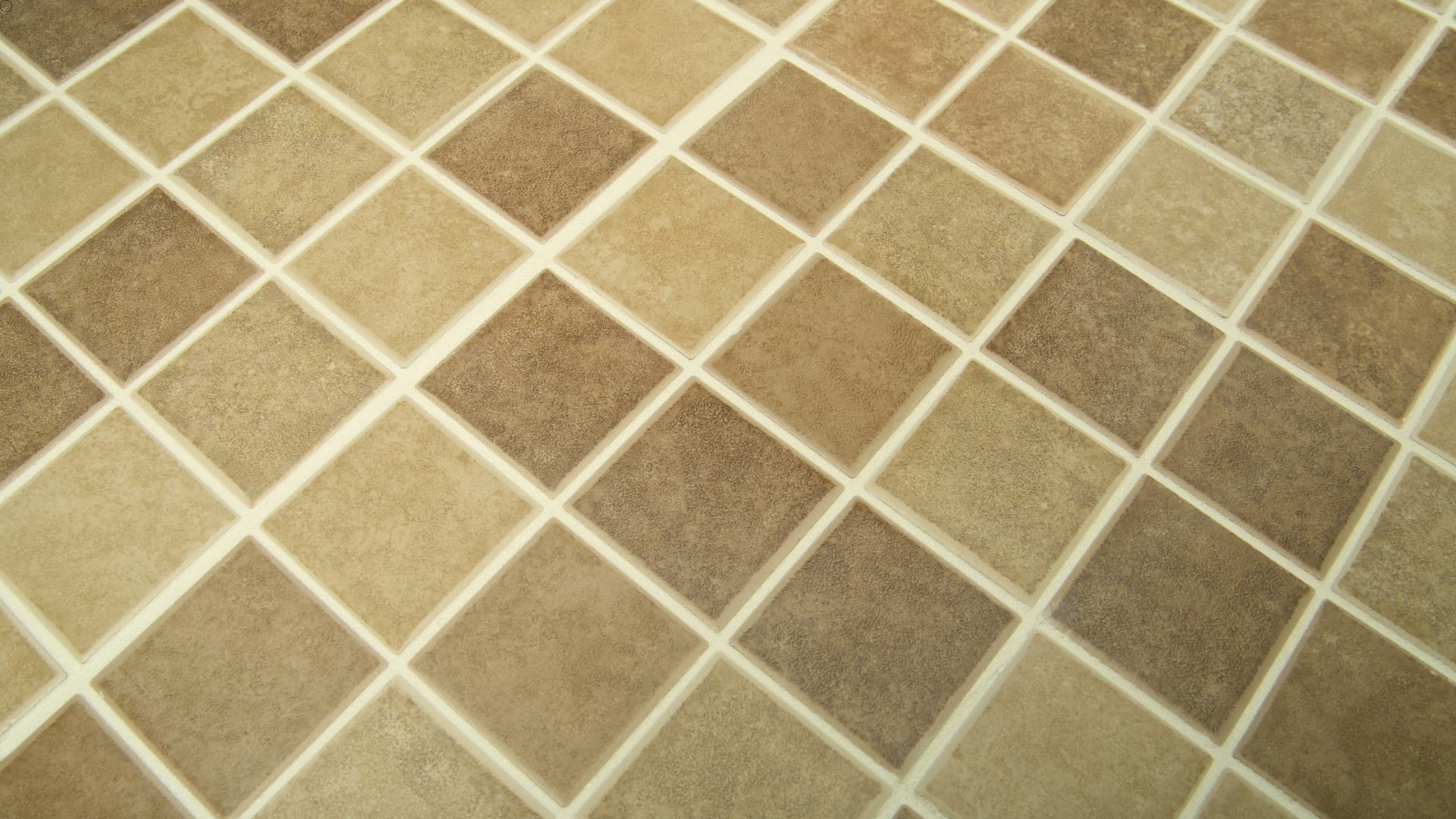 A close up of a tiled floor with a checkered pattern.