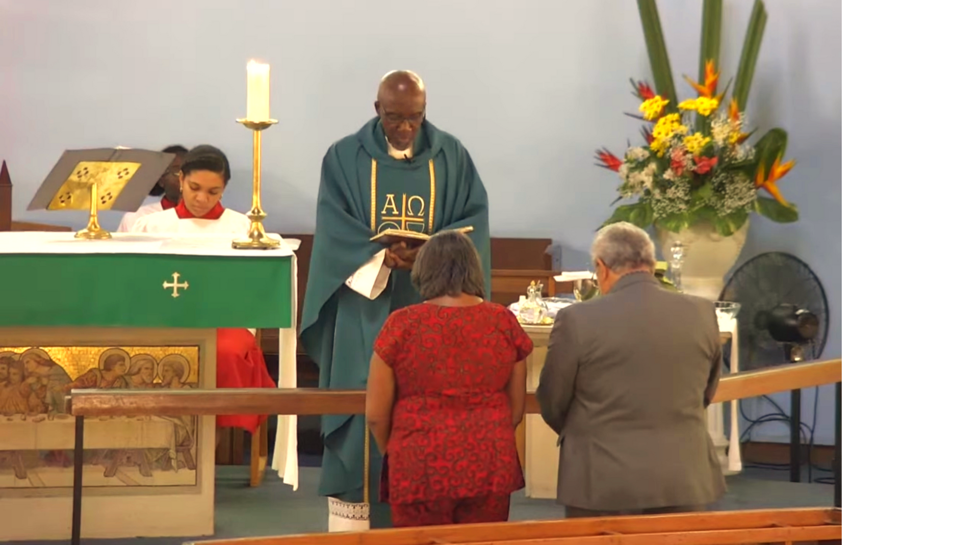 man and woman before priest.