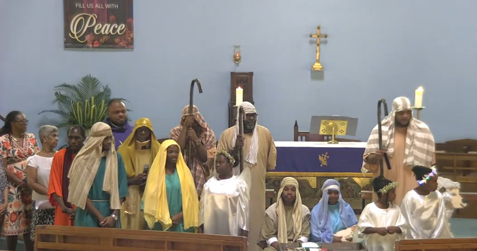 A group of people standing in front of a sign that says peace