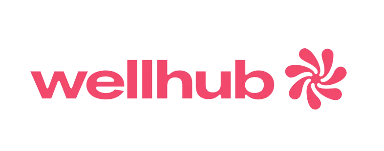 Il logo di Wellhub è rosso con un fiore al centro.