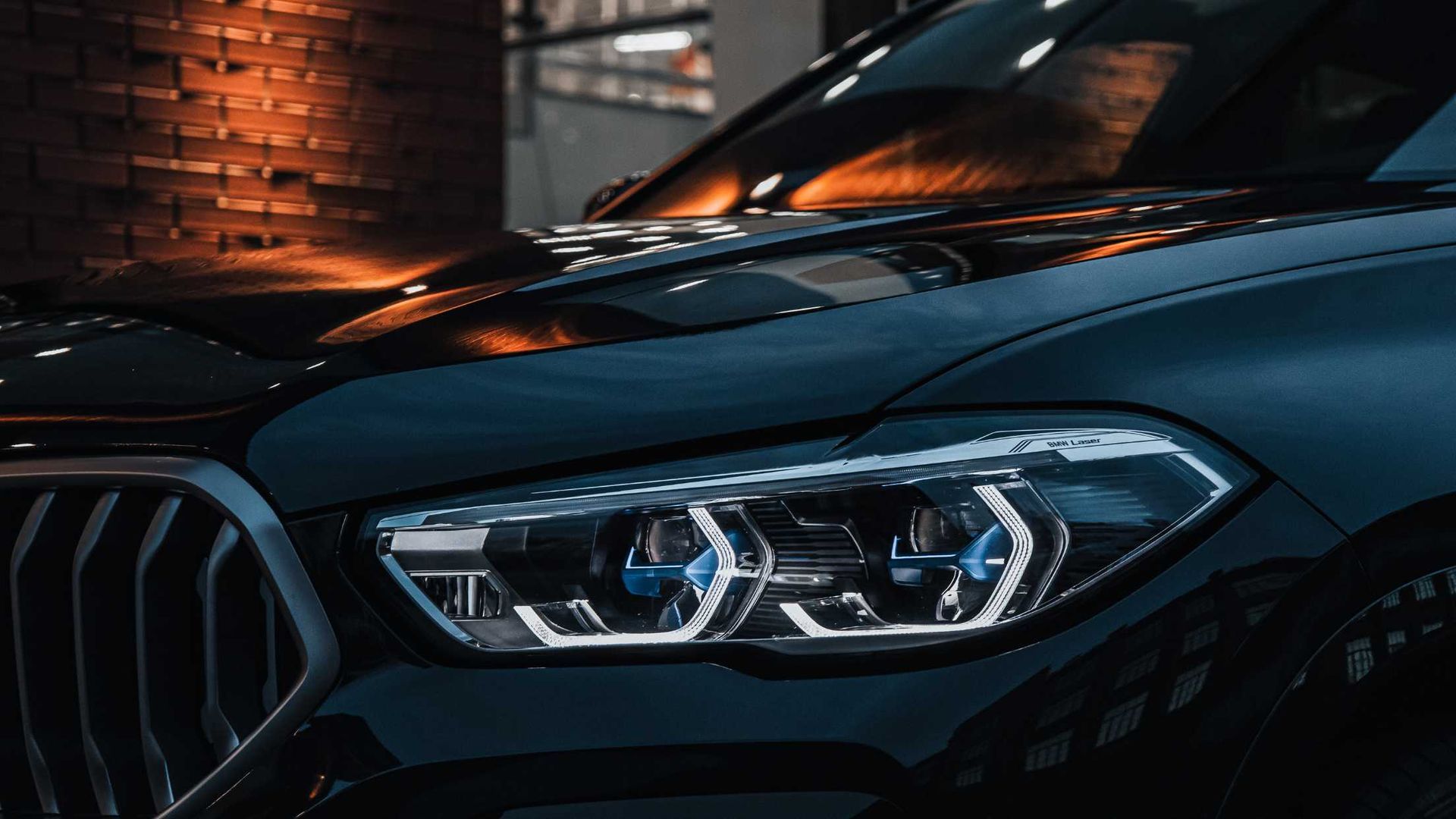 A close up of the headlights of a bmw x5.