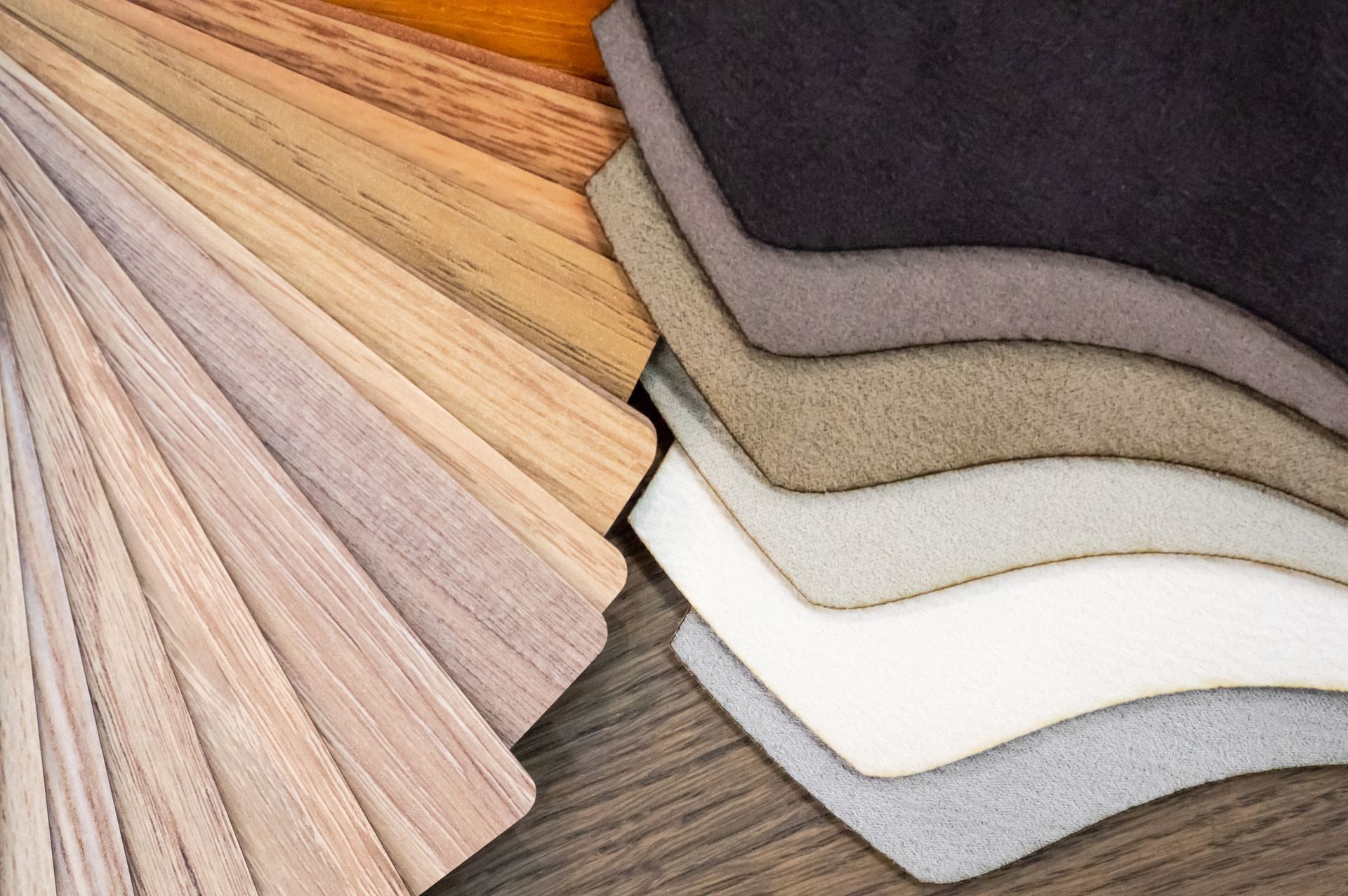Fan of wood and fabric samples in various neutral colors.