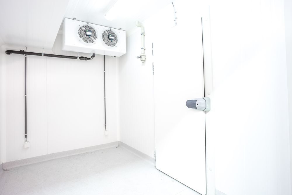 White Walk-in Freezer Room With a Closed Door — Cooling Plus Refrigeration & Airconditioning in Ciccone, NT