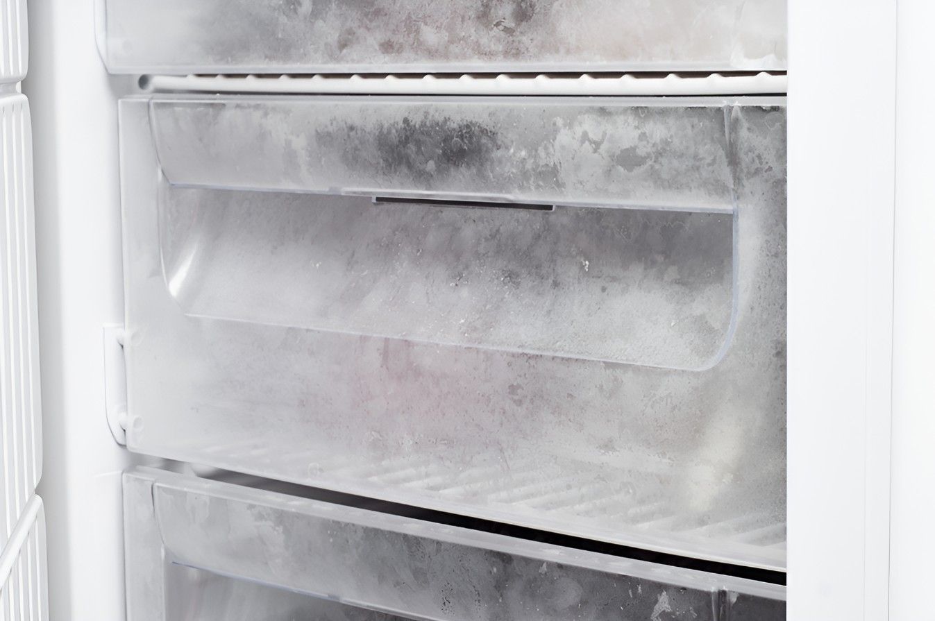 The Inside of an Empty Freezer With Ice on the Shelves — Cooling Plus Refrigeration & Airconditioning in Ciccone, NT