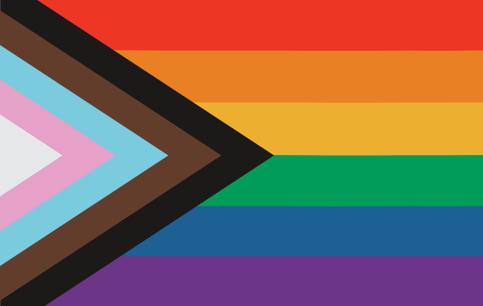 A close up of a rainbow flag with an arrow pointing to the right.