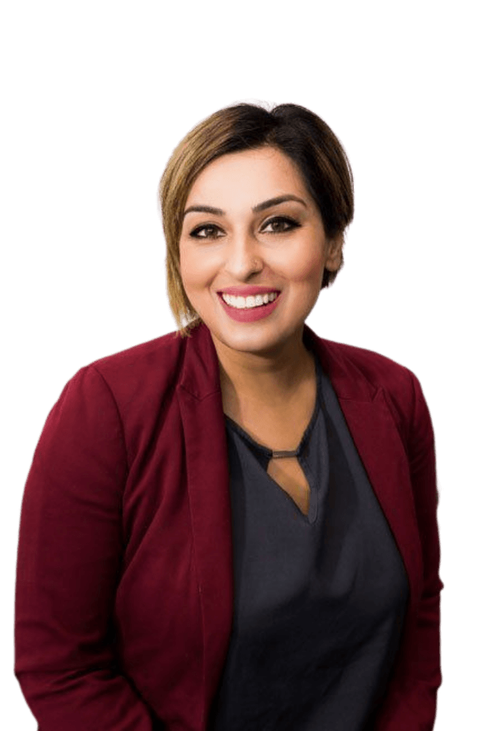 A woman wearing a red cardigan and a black shirt is smiling for the camera.