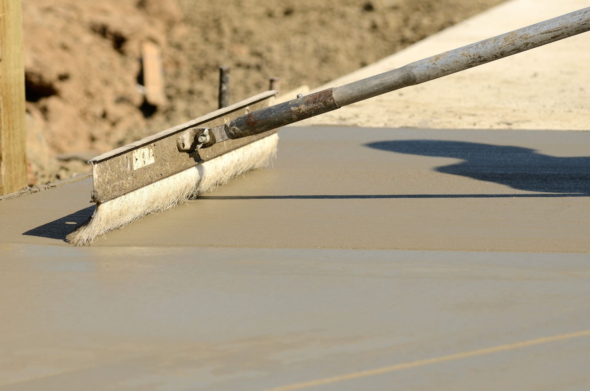 A concrete float is used to smooth fresh concrete.