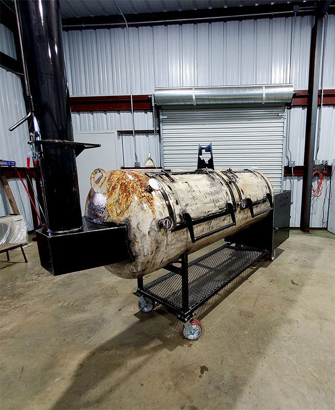 A room with a painting on the wall and a light hanging from the ceiling