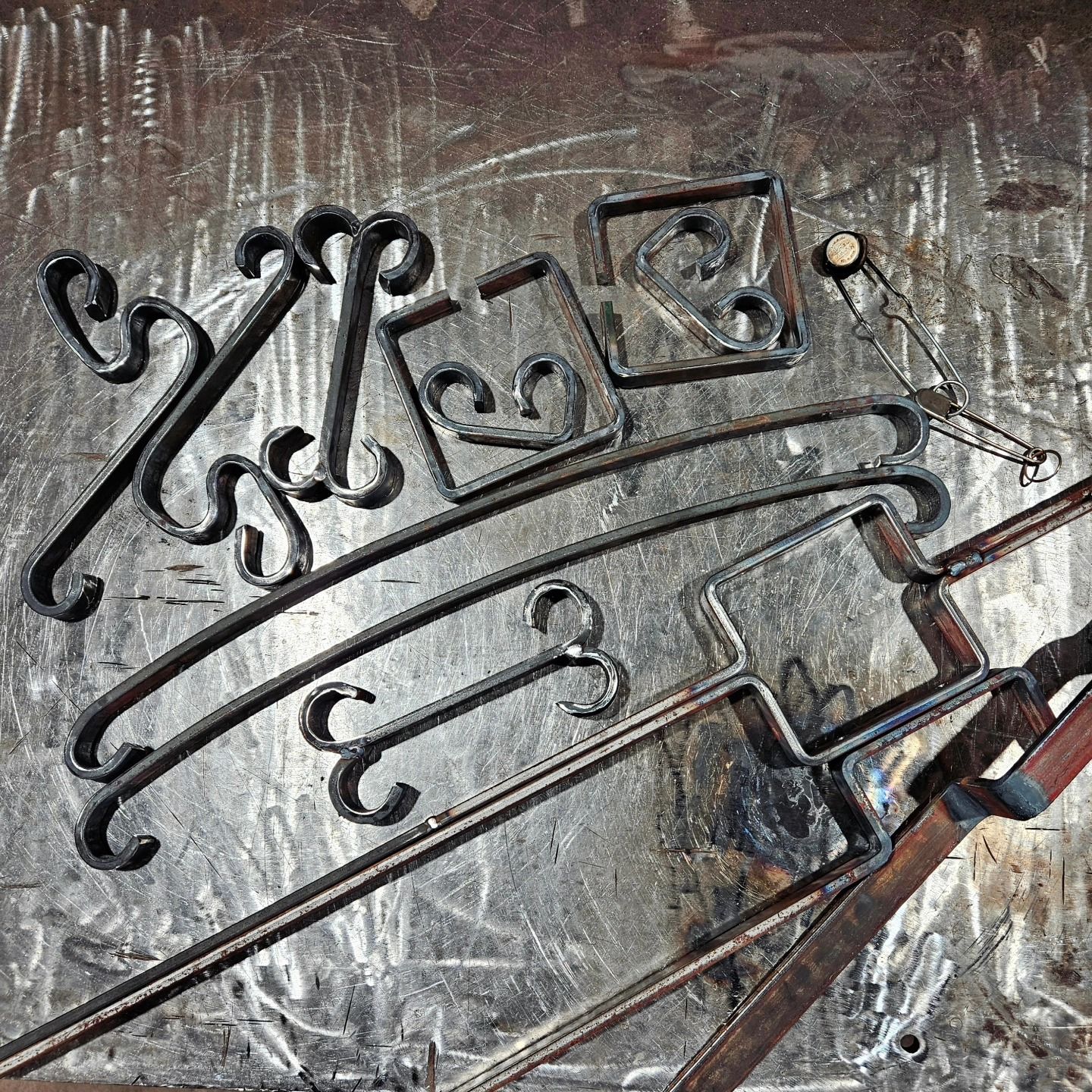 A bunch of metal pieces are sitting on a table.