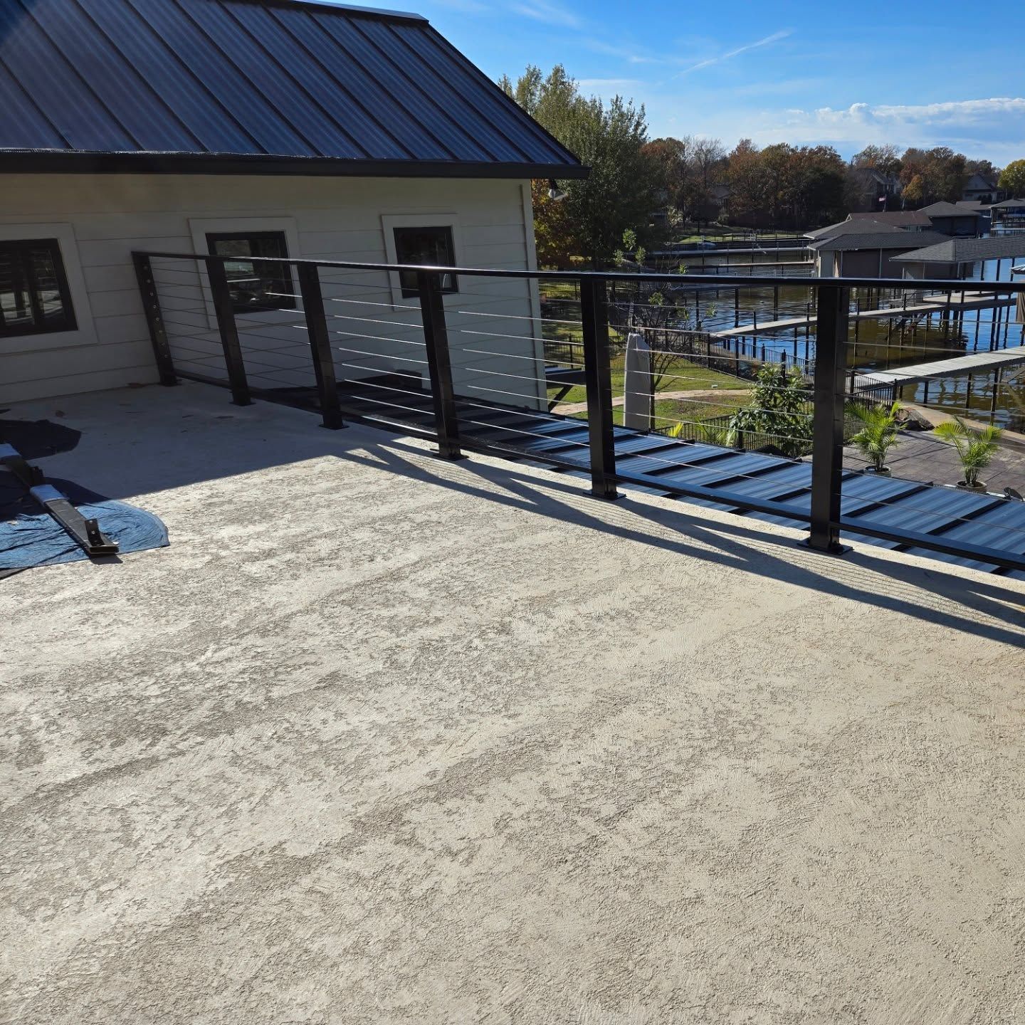A balcony with a view of a body of water