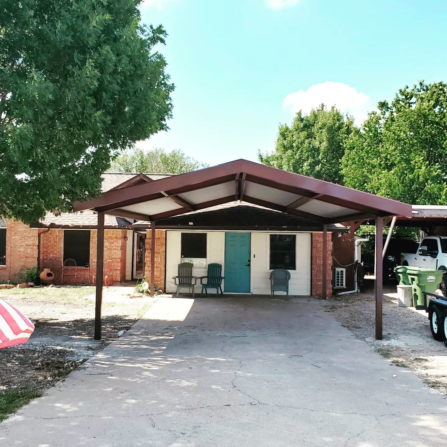 A house with a balcony and a brick chimney