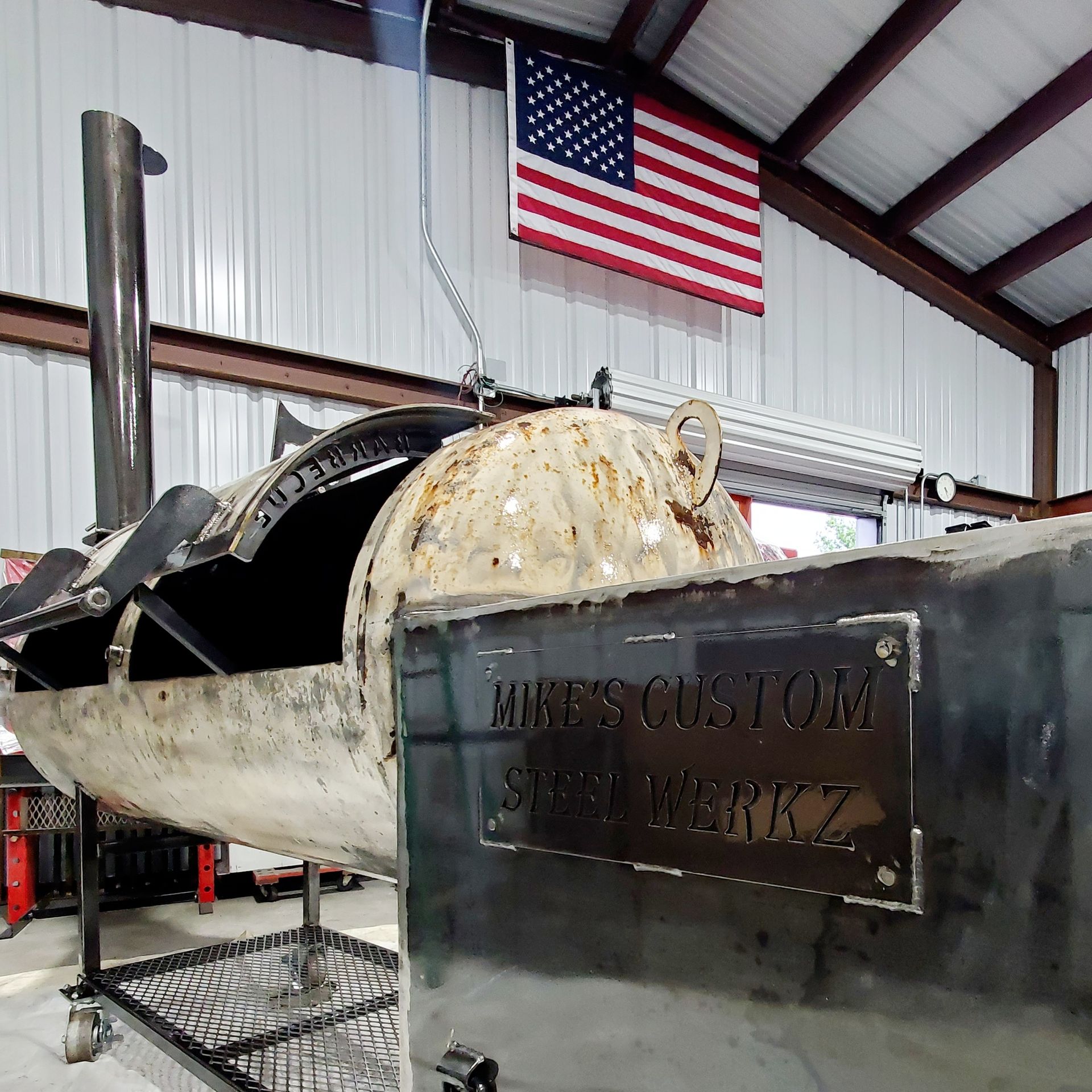 An american flag hangs from the ceiling of a building